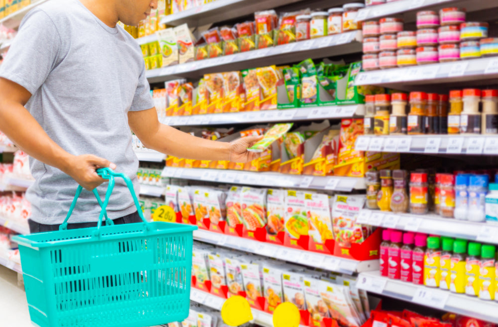 asian man shopping asian grocery store aisle blue basket 